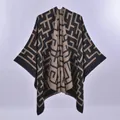 Women's reversible two-tone knit poncho with geometric maze patterns and soft draping - Overlocked Double-sided Maze Black Camel