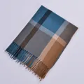 Close-up of blue and brown checkered cashmere-feel scarf with elegant fringe detail - Lake Blue