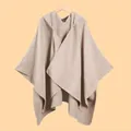 Detail view of knitted hooded shawl featuring beige textured weave and hem stitching - Solid Hooded Khaki