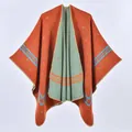 Detail of double-sided knit shawl showing ethnic geometric patterns and overlock edges - One Size / Robe / 130x150cm / Orange