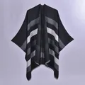 Women's reversible striped poncho cape in black and grey with elegant fringe trim - Overlocked Reversible Black Wide Stripe With Silver Metallic Thread