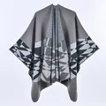 Detail of grey knitted shawl showing black and white geometric diamond patterns and texture - Khaki Black Geometric