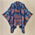 Women's autumn knit poncho with colorful abstract pattern and dark blue base - 130x150cm / Fluorescent Sea Blue