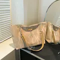 Chic beige textured tote bag with golden chain straps and elegant deer charm - Khaki