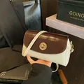 Braune und beige Umhängetasche aus Wachsleder mit goldenem Drehverschluss - Off-White & Kaffee