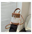 Detail view of contrast stitch bucket bag with gold zipper and textured fabric - Brown