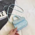 Mini borsa azzurra a pois con fiocco d'argento e tracolla sottile regolabile - Blu
