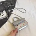 Borsa a tracolla argento con pois rossi e fiocco metallico per donna moda - Argento