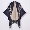 Women knit poncho featuring navy and beige geometric jacquard patterns with fringed hem - Navy Beige Geometric