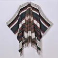 Detail of bohemian knit shawl featuring ethnic geometric patterns and long fringe tassels - Green/Brown Striped
