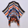 Bohemian knit poncho shawl with colorful stripes and fringe trim for winter - Blue & Orange Stripes
