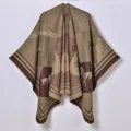 Close-up of thick knit shawl fabric featuring horse patterns and geometric textures - Horse And Belt Pattern / Coffee