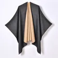 Dual-sided knit poncho shawl in dark charcoal gray and warm camel color - Black Camel