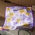 Detailed texture of lavender silk scarf with yellow floral prints on leather background - 70x70cm / Fresh Purple Camellia