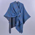 Detail of blue and grey grid knit shawl with functional loop buckle for winter - Deep Blue Plaid