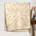 Elegant cream cotton linen scarf featuring brown floral prints and a dark brown border - Khaki Leaf
