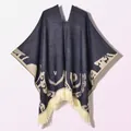 Detailed knit texture of navy blue and cream poncho with tassel edges and jacquard pattern - Pullover Poncho Origin Navy Blue