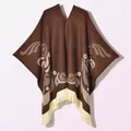 Detailed knit texture and beige fringe trim on a dark brown bohemian poncho wrap - Coffee (Mysterious Bird Pattern)