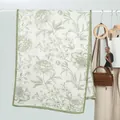 Detail of elegant floral velvet scarf with olive green botanical print and hemmed edges - Fruit Green