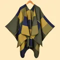 Close-up of geometric knit poncho shawl with olive green, navy, and mustard color blocks - Yellow Square Character