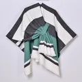 Striped shawl cape with teal and black patterns and front bow tie detail - Striped Green Black (Tassel Tie-up)