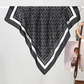 Detail of silk-like scarf with black and white geometric pattern and smooth texture - 70x70cm / Black