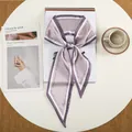 Close-up of lavender faux silk twilly scarf with decorative lettering on a magazine - Purple English Floral (25)