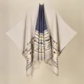 Detailed knit texture with geometric jacquard patterns and elegant fringe hem tassels - Bohemian Beige
