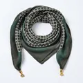 Detail view of dark green striped velvet scarf with white geometric rings and gold pendants - Magnetic Clasp Style / String Rings