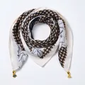 Detail of silk-texture magnetic scarf featuring houndstooth pattern and gold pendant - Magnetic Clasp Style / Rose Houndstooth