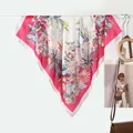 Detail of premium silk square scarf with tropical floral print and parrot motifs - Rose Red Floral Bird