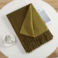 Moss green cashmere-like scarf with fringe tassels on a clean white table setting - Mustard Green