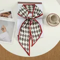 Close-up of red and grey diamond pattern silk scarf with elegant knotted styling - Large Slant - Rhombus Lattice