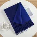 Detail of royal blue scarf with fringe on white table with coffee and magazine - Sapphire Blue