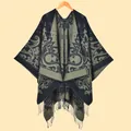 Close-up of olive green and navy paisley jacquard knit shawl with fringe trim details - Dark Green