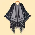 Detail of knit shawl featuring vintage floral jacquard pattern and fringe trim - Dark Grey