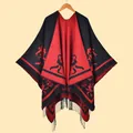 Ethnic knit shawl poncho with red and black floral jacquard pattern and fringe tassels - Black Red