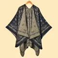 Detail of bohemian jacquard knit shawl featuring paisley patterns and olive green border - Paisley Vine Dark Green