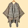 Close-up of vintage leopard paisley knit shawl featuring detailed floral weaving patterns - Paisley Vine Khaki