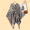 Detail of grey striped knit shawl wrap with a stylish twisted knot decoration - One Size