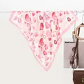 Detail of pink silk scarf with red heart patterns hanging on a white hanger - 70x70cm / Pink