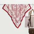 Elegant red and white paisley print silk satin square scarf displayed on white bar - Red Paisley Border / Red
