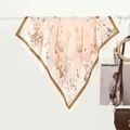 Detailed view of floral silk scarf featuring ink lotus print and contrast border - 70x70cm / Winter Plum Blossom