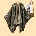 Green and beige knitted poncho featuring Scottish Terrier patterns in a warm lifestyle setting - Green