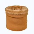 Close-up of caramel knitted neck warmer featuring thick faux fur lining for winter heat - Yellow