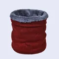 Detail of burgundy ribbed knit exterior and soft grey faux fur lining on winter neck warmer - Burgundy
