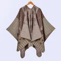 Detailed knit texture and geometric bohemian pattern on warm winter poncho shawl - Khaki
