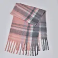 Close-up of thick plaid boucle scarf with pink and grey pattern and soft tassel fringe - Pink Gray