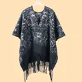 Detailed view of paisley print pattern and fringe tassels on a thick winter shawl - One Size / Paisley Black