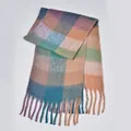 Macro detail of rainbow plaid scarf showing soft knit texture and long tassels - Lake Blue & Coffee Plaid